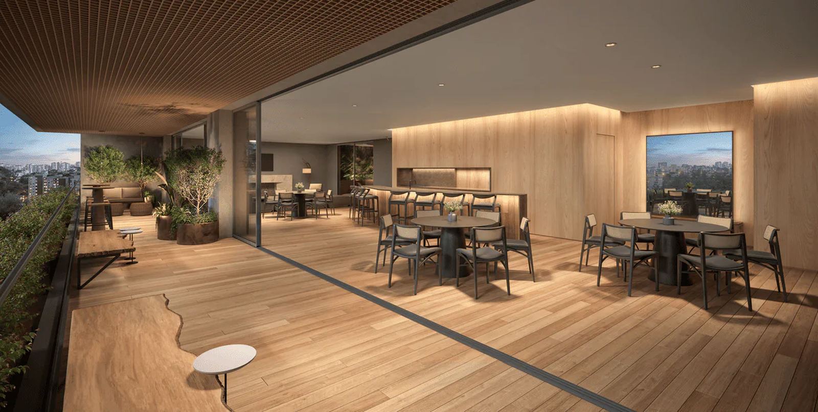 Lounge coberto com bar e mesas ao entardecer